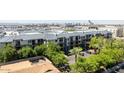 Multi-story condominium with landscaped grounds, pool, and easy access to city amenities at 1701 E Colter St # 147, Phoenix, AZ 85016