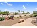 Outdoor community area featuring desert landscaping, seating, and a barbecue grill at 1941 S Pierpont Dr # 1014, Mesa, AZ 85206