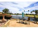 Enjoy the water view from the backyard with a wrought iron fence and patio at 21609 N 61St Ave, Glendale, AZ 85308