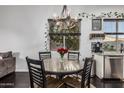 Cozy dining area with a chandelier, adjacent to a window with outdoor views at 2330 E Stephens Pl, Chandler, AZ 85225