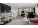 Bright living room with wood-look flooring, a television, and natural light at 2514 N 22Nd Ave, Phoenix, AZ 85009