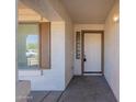 Inviting front porch with a storm door, and a view of the front lawn at 2847 S 161St Dr, Goodyear, AZ 85338