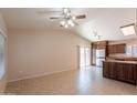 Spacious living room featuring neutral tones, tile floors, and sliding glass door that leads to patio at 31 W Loma Vista Dr # 102, Tempe, AZ 85282