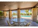 Relaxing pool view from the covered patio with seating and views of the pool at 31 W Loma Vista Dr # 102, Tempe, AZ 85282