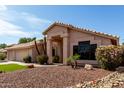 Charming single-story home with desert landscaping and rock features enhance the curb appeal at 3740 W Kent Dr, Chandler, AZ 85226