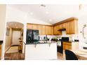 Open kitchen with granite countertops, a sink, stainless appliances, and wooden cabinets to make a functional space at 3756 E Alamo St, San Tan Valley, AZ 85140