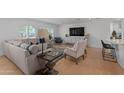 Elegant living room features hardwood floors, a large sofa, and ample seating at 4018 E Coolidge St, Phoenix, AZ 85018