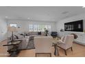 Bright living room with large windows, hardwood floors, and neutral decor at 4018 E Coolidge St, Phoenix, AZ 85018