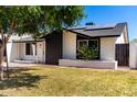 Charming single-story home with solar panels and inviting front entrance at 4147 W Reade Ave, Phoenix, AZ 85019