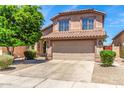 Exterior elevation with a two-story home and well-maintained front yard at 4426 E Coyote Wash Dr, Cave Creek, AZ 85331