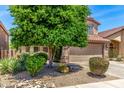 Charming two-story home featuring desert landscaping and a well-manicured front yard and an attached two car garage at 4426 E Coyote Wash Dr, Cave Creek, AZ 85331