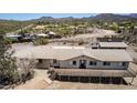 Overhead view of single-story home with large deck and desert surroundings at 48451 N 27Th Ave, New River, AZ 85087