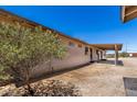 An exterior shot featuring a covered patio in the backyard of a home at 48451 N 27Th Ave, New River, AZ 85087