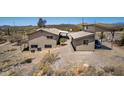 Aerial view showcases the sprawling property with auxiliary structure at 48451 N 27Th Ave, New River, AZ 85087