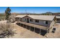 A beautiful single-story home featuring a large deck and mountain views at 48451 N 27Th Ave, New River, AZ 85087