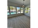 Bright sunroom featuring large windows overlooking a beautiful pool and backyard at 5088 S Ponderosa Dr, Gilbert, AZ 85298