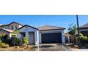 A charming home showcasing manicured landscaping, a neutral color palette, and a two-car garage at 6621 E Villa Rita Dr, Phoenix, AZ 85054