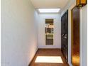Inviting tiled entrance with a secure gate and a skylight that bathes the area in natural light at 6818 N 35Th Ave # C, Phoenix, AZ 85017