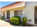 Charming townhome with a red-tile roof and a well-maintained front yard in a residential community at 6818 N 35Th Ave # C, Phoenix, AZ 85017