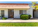 Charming townhome with a red-tile roof and a well-maintained front yard in a residential community at 6818 N 35Th Ave # C, Phoenix, AZ 85017