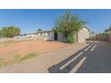 Single-story home with rock landscaping and a convenient driveway at 7619 W Clarendon Ave, Phoenix, AZ 85033