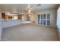 Spacious living room showcases the open floor plan, connecting to the kitchen area at 8161 E Keats Ave # 376, Mesa, AZ 85209