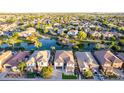 Picturesque community featuring a serene pond, tree-lined streets, and lovely homes, creating a tranquil and welcoming environment at 861 E Canyon Way, Chandler, AZ 85249