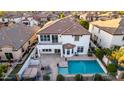 Stunning home features a spacious backyard oasis with a sparkling pool and covered patio, perfect for outdoor entertaining at 861 E Canyon Way, Chandler, AZ 85249