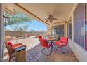 Covered patio area with ceiling fan, outdoor furniture, and barbeque area with a view at 8687 W Bajada Rd, Peoria, AZ 85383