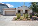 Charming single-story home with a well-maintained yard and a neutral color scheme at 9921 E Acceleration Dr, Mesa, AZ 85212