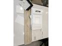 An attractive display of material selections, including flooring, cabinet and brick samples, and countertop options at 1180 E Peach Tree Dr, Chandler, AZ 85249