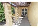 Covered entryway featuring a decorative security door and a tiled walkway at 13012 N 26Th Dr, Phoenix, AZ 85029