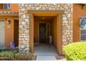 Inviting entryway with a decorative wreath and a welcome sign, creating a warm ambiance at 18649 W Williams St, Goodyear, AZ 85338