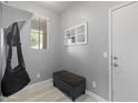 Cozy mudroom featuring a storage bench and hooks for organization and convenience at 18649 W Williams St, Goodyear, AZ 85338