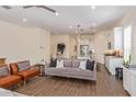 Cozy living room featuring modern furniture, hardwood floors, and bright, airy space at 1951 W Plum Rd, Phoenix, AZ 85085