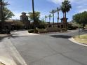 View of the Verrado Golf Club entrance with lush landscaping and beautiful desert scenery at 21183 W Main St, Buckeye, AZ 85396