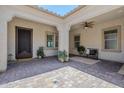 Inviting courtyard with paver flooring, a seating area, and classic architectural details at 22255 E Quintero Rd, Queen Creek, AZ 85142