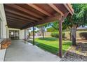 The covered patio overlooks the expansive backyard with mature landscaping at 2264 S Don Carlos --, Mesa, AZ 85202