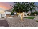 Charming single-story home featuring a decorative stone facade, and gravel landscaping at 3911 N 197Th Ave, Buckeye, AZ 85396