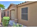 Close-up of a home's entry with security door and desert landscaping at 41812 W Sunland Dr, Maricopa, AZ 85138