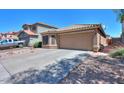 Charming one-story home with desert landscaping and a convenient two-car garage at 41812 W Sunland Dr, Maricopa, AZ 85138