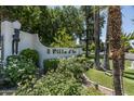Community entrance with manicured landscaping and decorative signage at 4226 N 69Th Pl, Scottsdale, AZ 85251