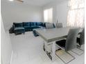 Dining room and sitting area featuring tile floors, neutral colors and furniture at 4255 N 68Th Dr, Phoenix, AZ 85033