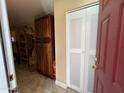 View of the entryway with closet space and a glimpse of a tiled floor at 4626 W Altadena Ave, Glendale, AZ 85304