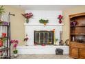 Brick fireplace with decor and wood storage at 4626 W Altadena Ave, Glendale, AZ 85304
