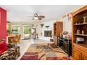 Open living room with tile floors, fireplace, and a sliding glass door to the backyard at 4626 W Altadena Ave, Glendale, AZ 85304