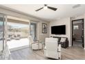 Inviting living room with sliding glass doors leading to an outdoor patio at 4898 N 206Th Ln, Buckeye, AZ 85396