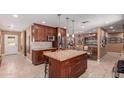 Beautiful kitchen with a large island, granite countertops, stainless steel appliances, and access to outdoor spaces at 6532 E Aster Dr, Scottsdale, AZ 85254