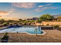 Sparkling pool and spa with custom tiling, desert vegetation and mountain views in background at 6551 E Flat Iron Loop, Gold Canyon, AZ 85118