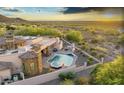 Backyard featuring a private pool and spa with a covered patio area, perfect for outdoor entertaining at 6551 E Flat Iron Loop, Gold Canyon, AZ 85118